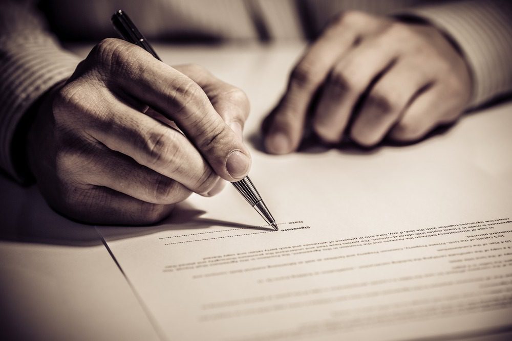 person signing finance contract