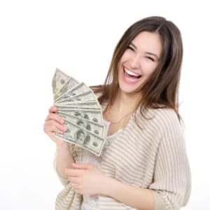 young lady holding cash