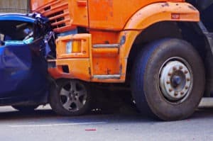 Sterling Heights Lawsuit Loans | Tribeca Lawsuit Loans A car crushed by a truck.
